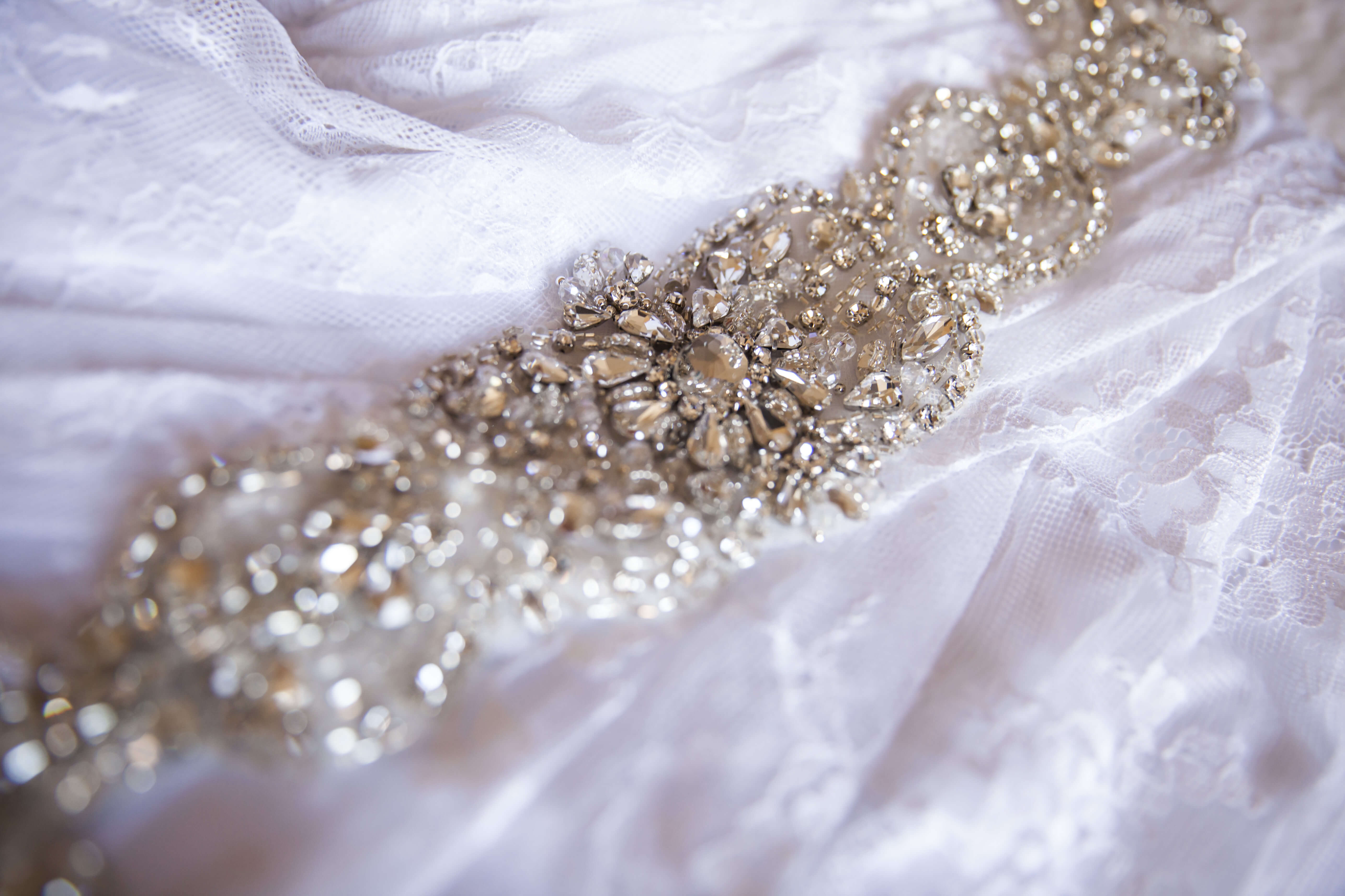 close up of the details on the bride's wedding dress