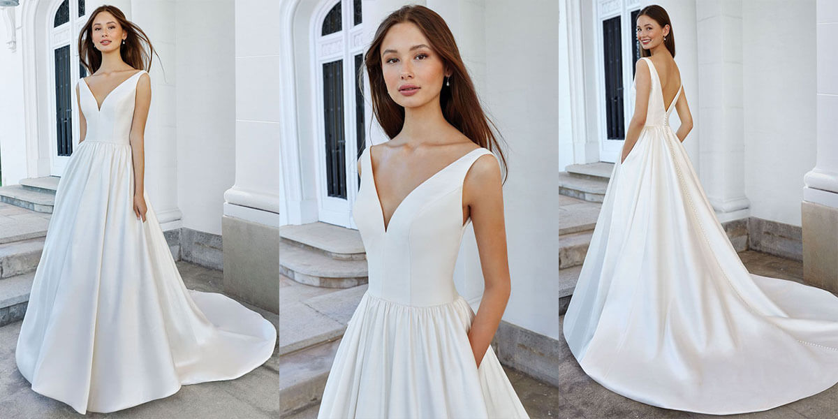 A Justin Alexander ball gown with deep V neckline