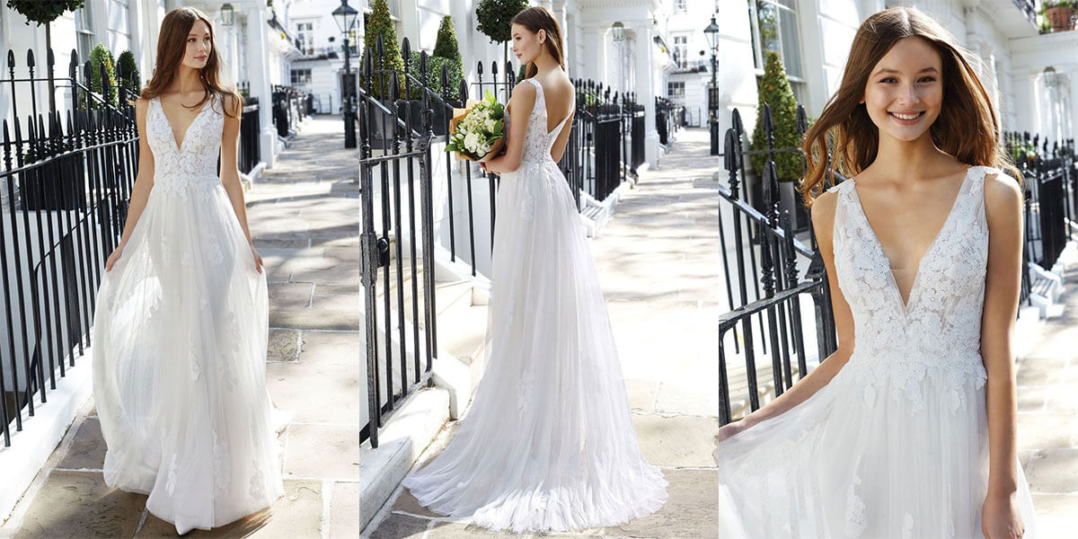 A flowing A-line bridal gown with a deep plunge and low V back neckline from Justin Alexander