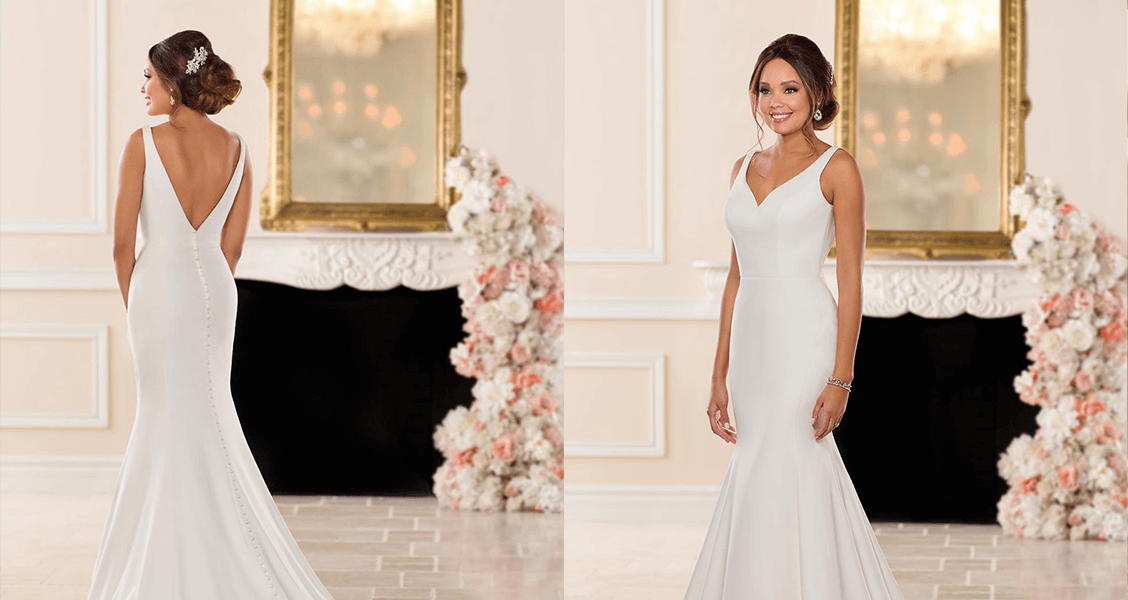 The Paris dress from Stella York featuring a trumpet silhouette and a curved V neckline.