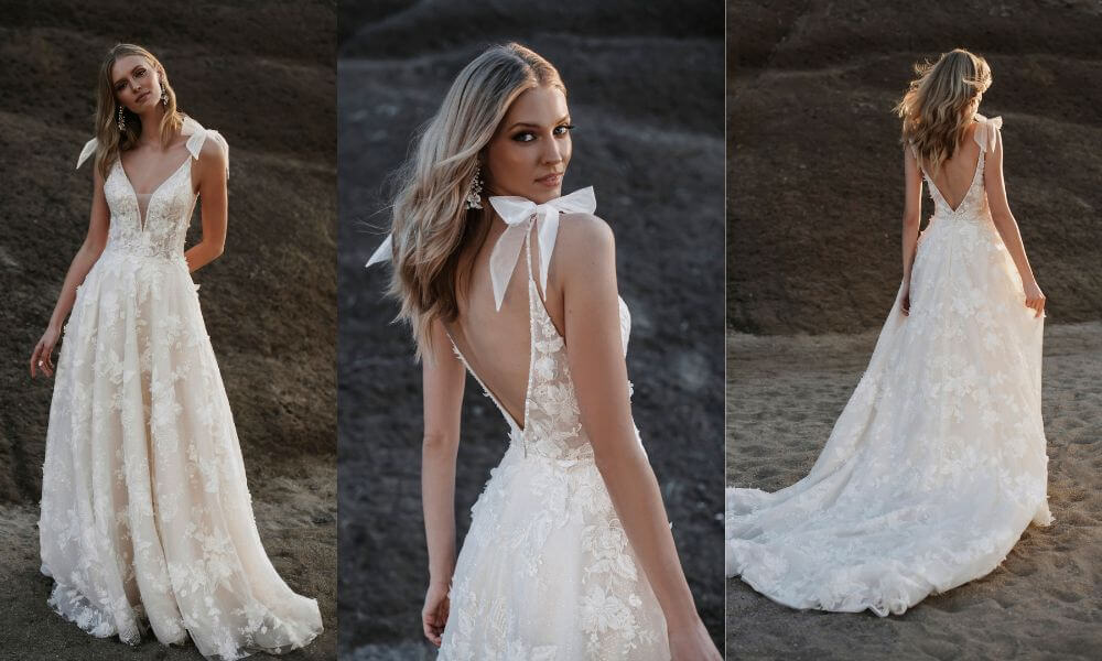 beautiful bride wearing a backless wedding dress with lace flowers and ribbons on the shoulders