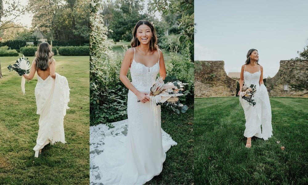 A happy bride wearing an elegant wedding dress with lace on the chest and silky fabric on the bottom